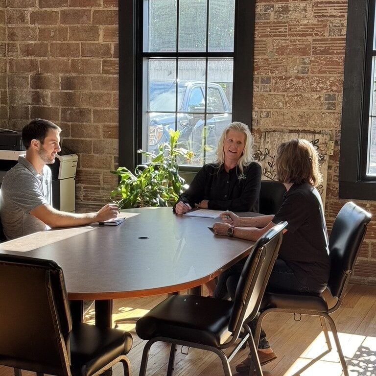kdl team sitting at a table